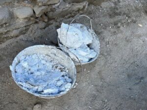 Buckets of lime for conservation work.