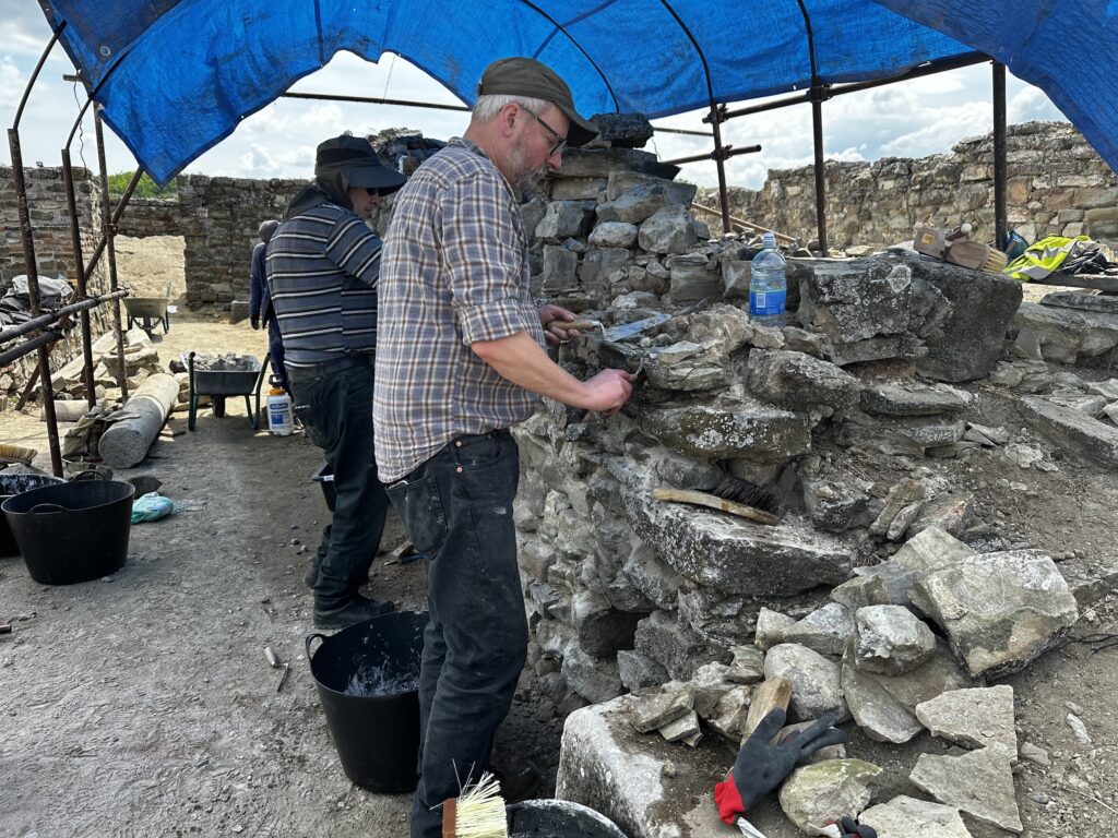 Conservators working on repairing a wall at the site of the Theodosian Palace, Stobi, North Macedonia.