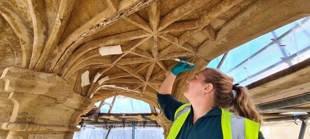 Skillingtons conservator at work on the Grade II* listed fifteenth-century Market Cross, treating the vaulted ceiling inside.