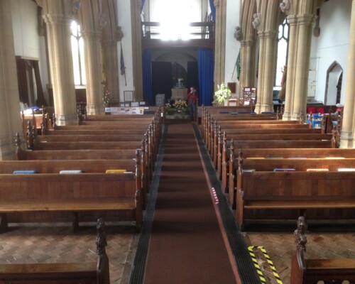 Old flooring before installing a new design by Skillingtons at Wells-next-the-Sea church.