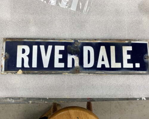 Blue enamel street sign from Horncastle, during conservation Blue enamel street sign from Horncastle, during conservation