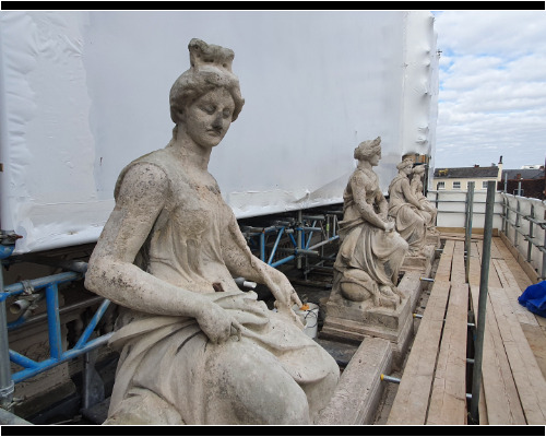 Sculptures atop Ipswich Post Office, during cleaning. Sculptures atop Ipswich Post Office, during cleaning.